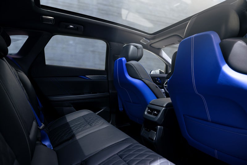 Back Seat View of the 2026 OPTIQ-V Blue Front Seats, Sun Roof, and Interior | King O'Rourke Cadillac in Smithtown NY