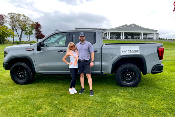 Lica Golf Outing Posing in front of vehicle