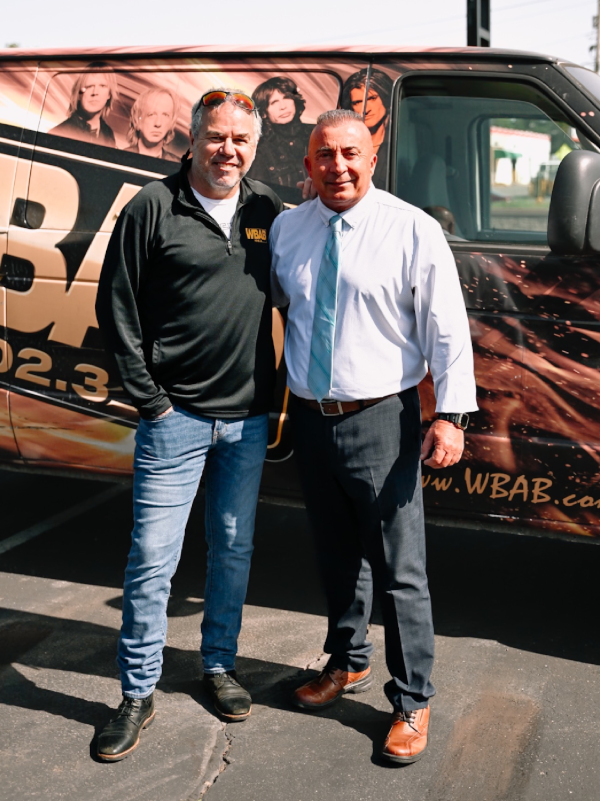 People Posing in front of WBAB Car