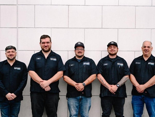 King O'Rourke Cadillac group photo in front of wall