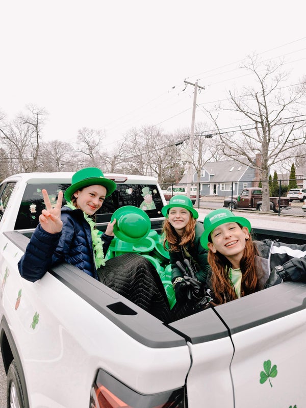 Saint Patrick's Day Parade kids riding in back of truck